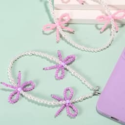 2 stuks kralen telefoonhangers met strikjes, universele esthetische delicate schattige parel strik kralen telefoon polsband voor tas camera oordopjes hoesjes decoratie (roze en paars) — thumbnail 2