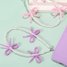 2 stuks kralen telefoonhangers met strikjes, universele esthetische delicate schattige parel strik kralen telefoon polsband voor tas camera oordopjes hoesjes decoratie (roze en paars) — thumbnail 2
