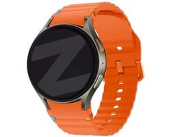 Horlogebandje - Smartwatch bandje - Watchband - Geschikt voor Samsung Galaxy Watch 7 (40 & 44mm) / 6 Classic (43 & 47mm) / 5 (Pro) / 4 (Classic) / FE - Siliconen Wave - Oranje - Jonyx
